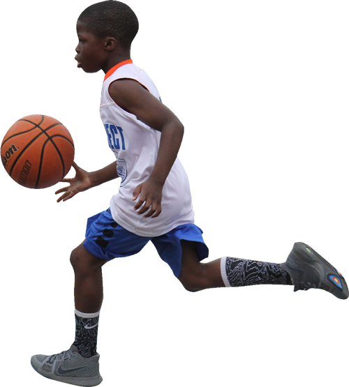 Photo of a Kid Playing Basketball